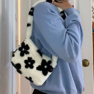 Fluffy purse with zipper white with black flowers